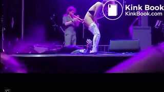 singer pisses on fan on stage.