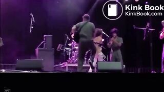 singer pisses on fan on stage.