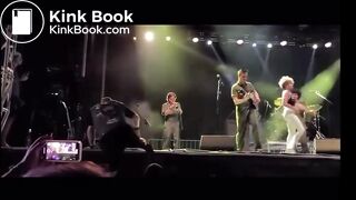 singer pisses on fan on stage.