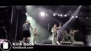 singer pisses on fan on stage.