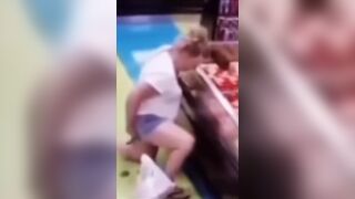 Security video. Woman make diarrhea in shop