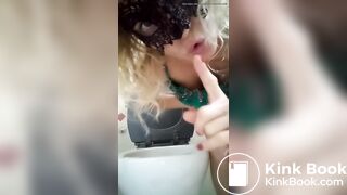 Blonde woman in dress defecates