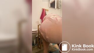 Diaper girl pushes out a big mess and pisses