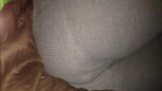 Woman fills pajamas in bed.