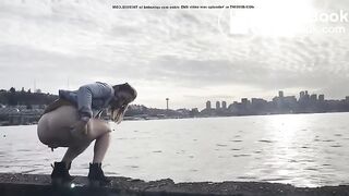 girl shitting in a lake shore