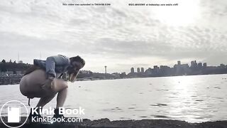 girl shitting in a lake shore