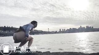 girl shitting in a lake shore