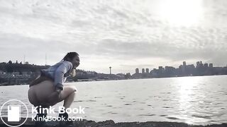 girl shitting in a lake shore