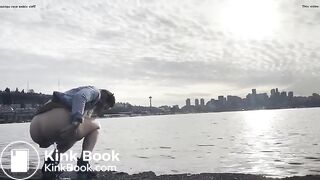 girl shitting in a lake shore