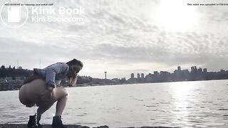 girl shitting in a lake shore