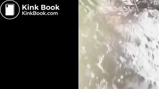 asian shitting in water stream