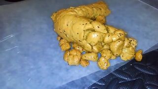 Yellow poo with seeds..