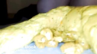 Yellow poo with seeds..