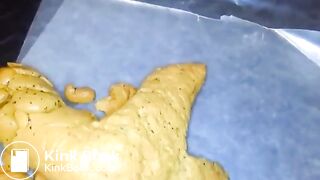 Yellow poo with seeds..