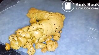 Yellow poo with seeds..