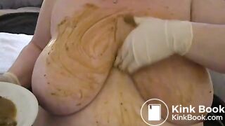 Smearing poo on huge tits..
