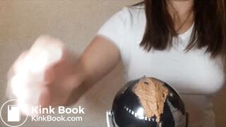 Girl shits on a globe