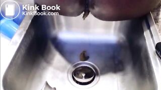 Girl poop on the kitchen sink