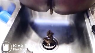 Girl poop on the kitchen sink