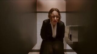 Woman has diarrhea in stall with broken door scene