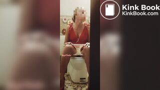 Girl in a red dress pissing at a party