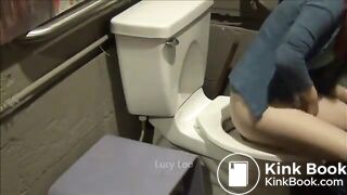 Redhead girl uses toilet
