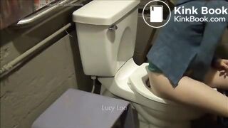 Redhead girl uses toilet