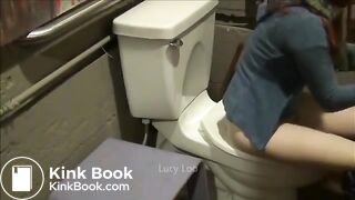 Redhead girl uses toilet