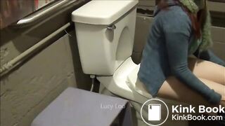 Redhead girl uses toilet