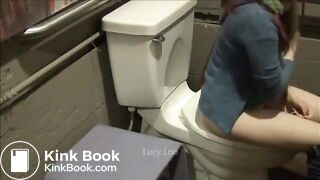 Redhead girl uses toilet