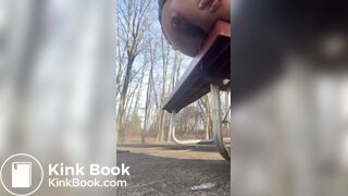 Girl shits off the side of a park bench