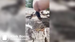 Girl shits outdoors on a hiking trip