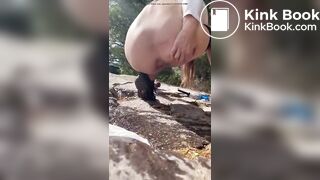 Girl shits outdoors on a hiking trip