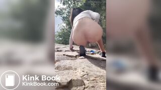 Girl shits outdoors on a hiking trip