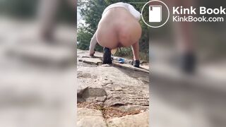 Girl shits outdoors on a hiking trip