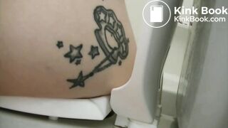 Tattooed girl toilet explosion