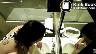 2 women pooping with reflections in a mirror
