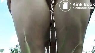 Lovely granny poops in a field..