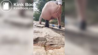 Cute girl outdoor shitting on the rocks