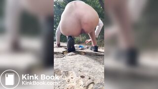 Cute girl outdoor shitting on the rocks