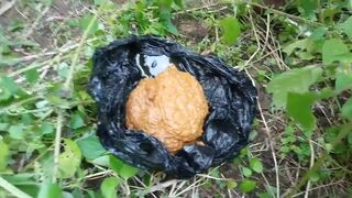 African lady pooping in the jungle..