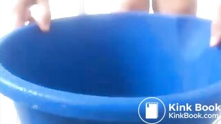 blonde pornstar 2 shits in her hand and a bucket