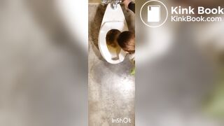 Two women shitting in public toilet