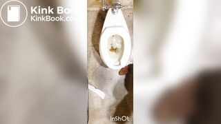 Two women shitting in public toilet
