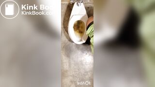 Two women shitting in public toilet