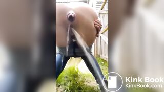 crazy bitch shits in her front yard in public view