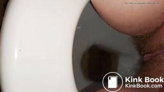 Girl with hairy pussy poops filmed between the legs
