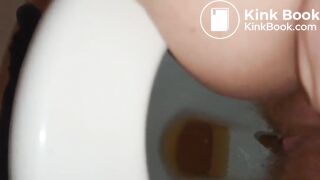 Girl with hairy pussy poops filmed between the legs
