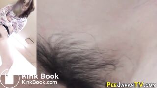 Asian girls peeing in a container