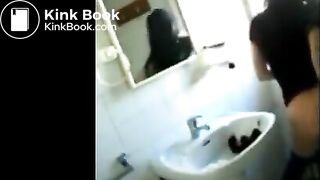 Woman shitting in the sink